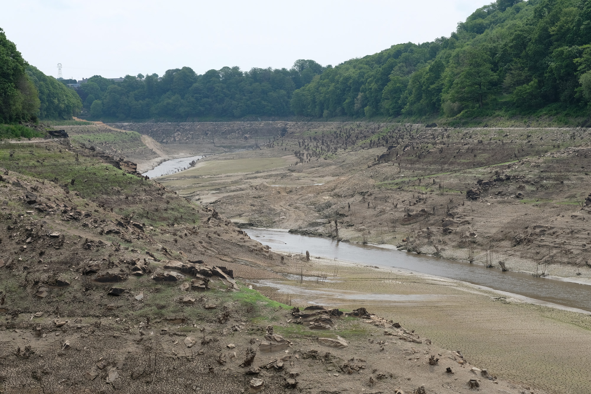 The empty reservoir above the Vezins Dam following drainage